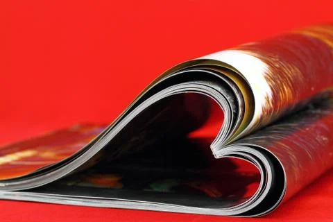 Selective focus image of magazine folded into a heart shape Stock Photos
