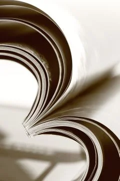 Selective focus image of magazine folded into a heart shape Stock Photos