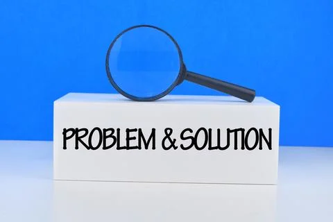 Selective focus image of manifying glass with Problem And Solution wording on Stock Photos