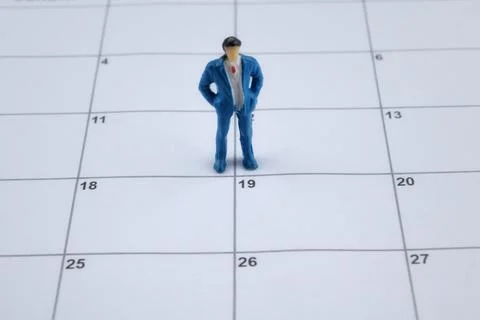 Selective focus image of miniature on a calendar with copy space and blur bac Stock Photos