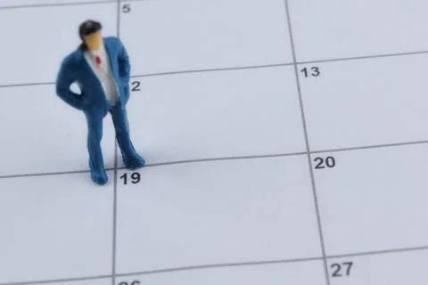 Selective focus image of miniature on a calendar with copy space and blur bac Stock Photos