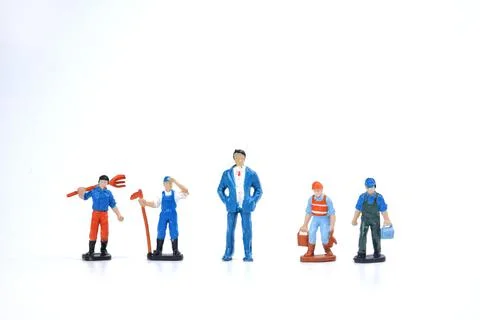 Selective focus image of miniature of rich people and poor people on white ba Stock Photos