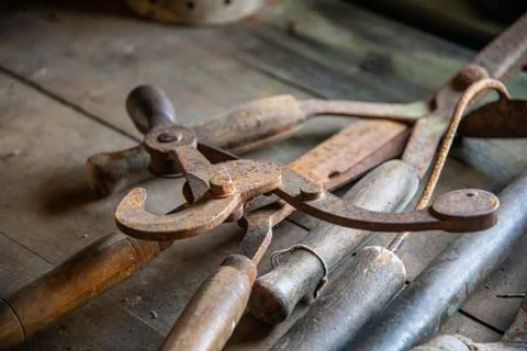 A selective focus image of old garden tools Stock Photos