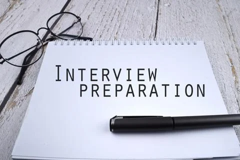 Selective focus image of pen and spectacles with Interview Preparation wordin Stock Photos