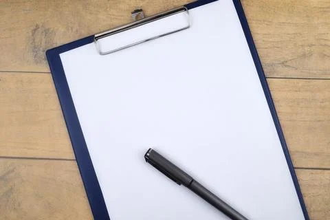 Selective focus image of pen and file holder on wooden background with copy s Stock Photos