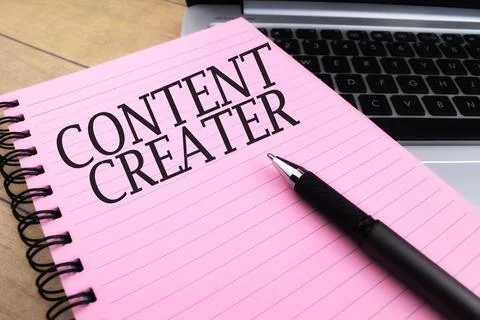 Selective focus image of pen and book with CONTENT CREATER wording. Business  Stock Photos