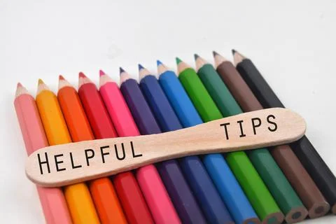 Selective focus image of pencil color with HELPFUL TIPS wording isolated on a Stock Photos