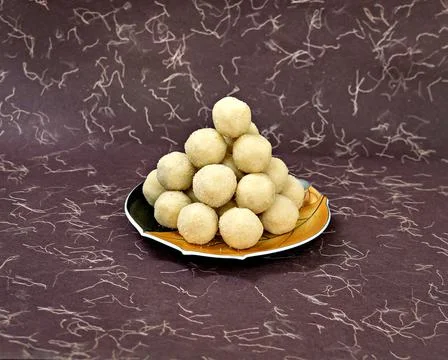 Selective focus image of a pile of delicious Indian sweet Rava , semolina lad Stock Photos