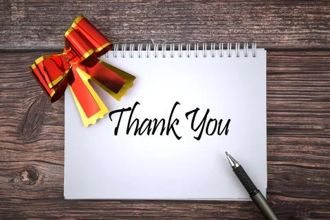 Selective focus image of red shiny ribbon and pen with Thank You wording on a Stock Photos