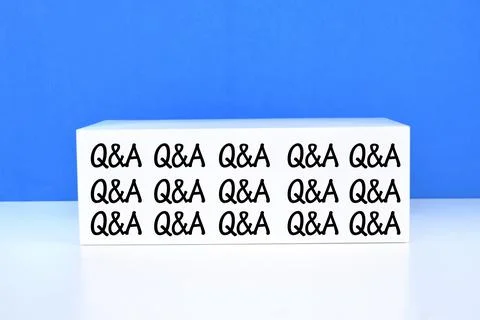 Selective focus image of repeating word Q and A over the blue background Stock Photos