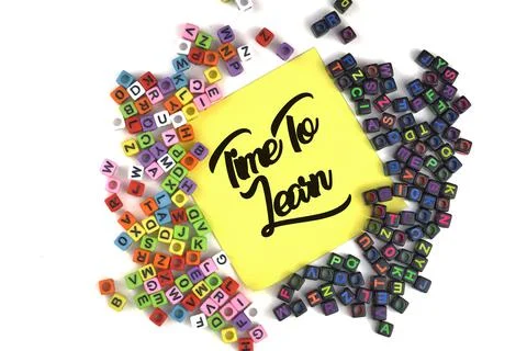 Selective focus image of scattered word with Time To Learn wording on a yello Stock Photos