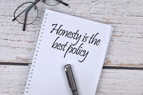 Selective focus image of spectacles and pen with Honesty is best policy wordi Stock Photos