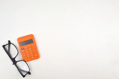 Selective focus image of spectacles and calculator isolated on a white backgr Stock Photos