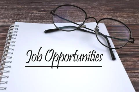 Selective focus image of Spectacles with Job Opportunities wording on a woode Stock Photos