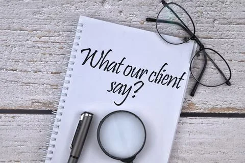 Selective focus image of spectacles, magnifying glass and pen with What Our C Stock Photos