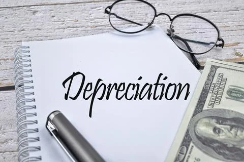 Selective focus image of spectacles, pen and bank note with Depreciation word Stock Photos