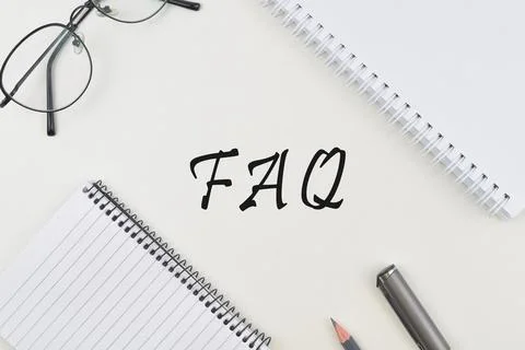Selective focus image of spectacles,note book, pencil and pen with FAQ wordin Stock Photos