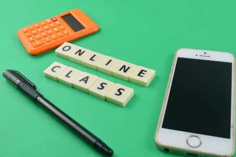 Selective focus image of stationary kits and smartphone with online class wor Stock Photos