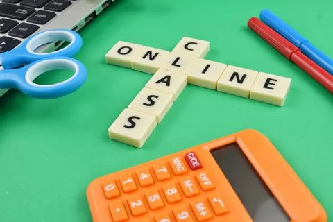 Selective focus image of stationary kits with online class wording on green b Stock Photos