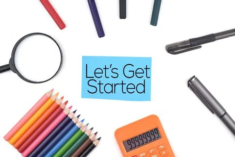 Selective focus image of stationary kits with Let's Get Started wording on a  Stock Photos