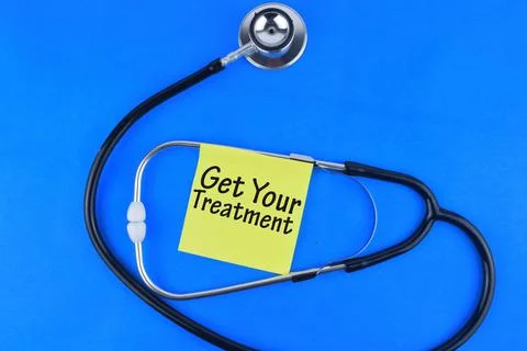Selective focus image of stethoscope and sticky note with Get Your Treatment  Stock Photos