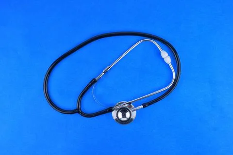 Selective focus image of stethoscope on a blue background.Medical concept Stock Photos