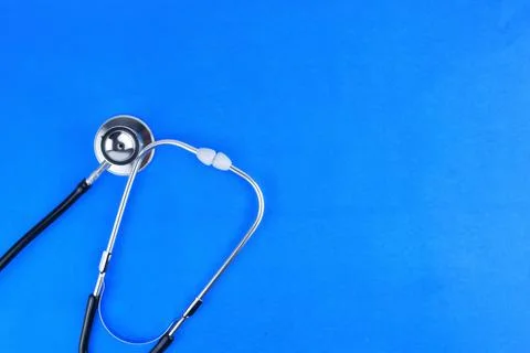 Selective focus image of stethoscope on a blue background.Medical concept Stock Photos