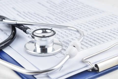 Selective focus image stethoscope over a document serial code. Medical concep Stock Photos