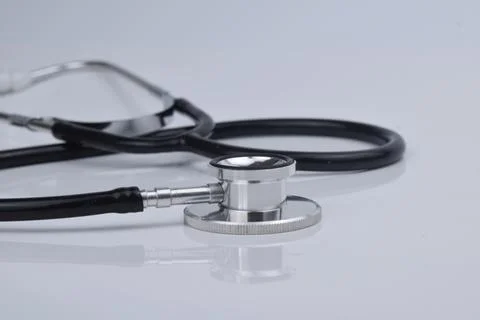 Selective focus image of stethoscope on a white background with blur effect.  Stock Photos