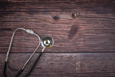 Selective focus image of stethoscope on a wooden background.Medical concept Stock Photos
