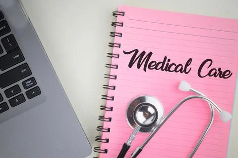Selective focus image stethoscope,notebook and laptop with Medical Care wordi Stock Photos