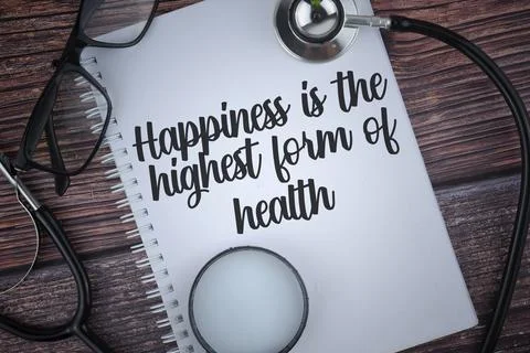 Selective focus image of stethoscope,spectacles and note book with Happiness  Stock Photos