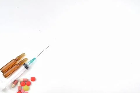 Selective focus image of syringe injection with medicine on a white backgroun Stock Photos