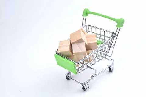 Selective focus image of trolley cart with wooden block isolated in white bac Stock Photos