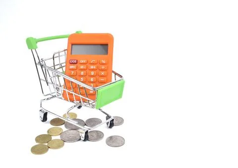 Selective focus image of trolley cart with calculator and stacked coins isola Stock Photos