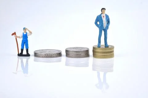 Selective focus image of working person miniature and rich people with stack  Stock Photos