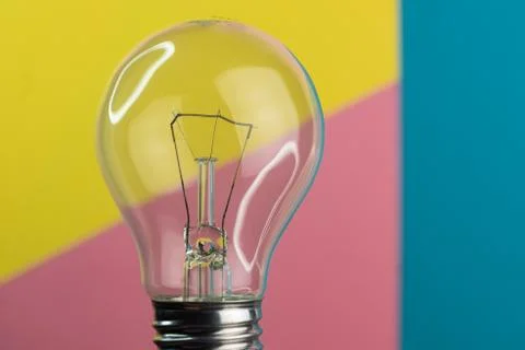 Selective focus, incandescent light on a colored background Stock Photos