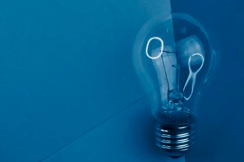 Selective focus, incandescent light on a colored background Stock Photos