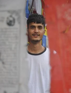 Selective focus of a indian young guy looking at camera Stock Photos