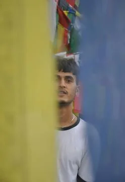 Selective focus of a indian young guy looking at camera Stock Photos