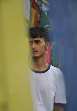 Selective focus of a indian young guy looking sideways Foto stock