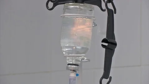 Selective focus Infusion bottle with IV solution in the patient room Stock Footage 81648559