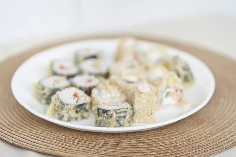 Selective focus on Japanese sushi rolls with raw fish. Delicious rolls are on Stock Photos