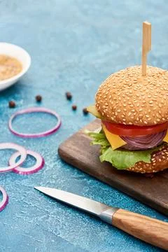 Selective focus knife delicious cheeseburger Stock Photos