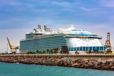 Selective focus. Large cruise ship and waterfront on the Mediterranean sea Stock Photos