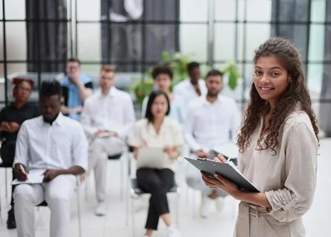 Selective focus of lecturer talking to audience during seminar in conference Stockfoto's