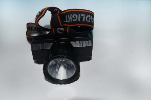 Selective focus LED headlamp on isolated white background Stock Photos