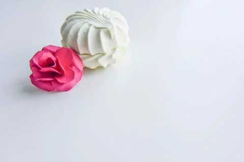 Selective focus at the light green marshmallow with fuchsia flower Stock Photos