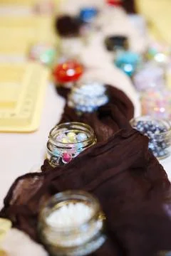 Selective Focus Macro of Glass Jars with Small Beads 스톡 사진
