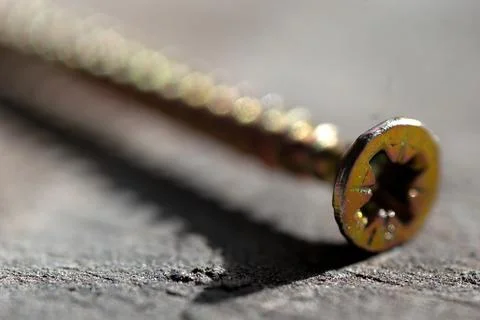 Selective focus, macro photography of a tapping screw with a cross head Stock Photos